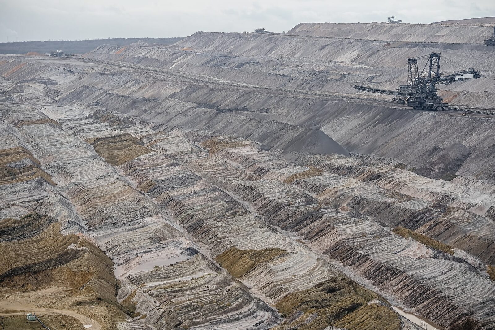 Aerial view of an open-pit mine and its terraced workings
